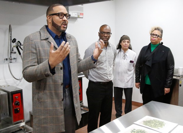 Gary Mayor Eddie Melton (left) addresses the crowd as Pastor Curtis Whittaker, Faith Farms Founder, Chef Lucero Martinez, and Ami McReynolds, Chief Equity Officer, Feeding America listen during the grand opening ceremony at Faith Farms and Orchard in Gary. The Faith Fresh Frozen program is a new initiative aimed at promoting healthier lifestyles and fostering community well-being in the city. The ground breaking took place on Thursday, March 21, 2024. (John Smierciak/for the Post Tribune)