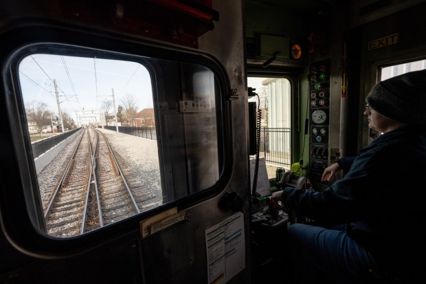 A South Shore train operated by engineer Taylor Goins crosses from single-track to double-track in Michigan City during a demonstration run of the new track on Tuesday, March 19, 2024. (Kyle Telechan/for the Post-Tribune)