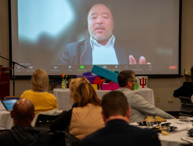 Indiana University Northwest chancellor Ken Iwama speaks to local education leaders via Zoom during the annual Northwest Indiana School Superintendents' Luncheon at Indiana University Northwest in Gary on March 1, 2024. (Michael Gard/Post-Tribune)