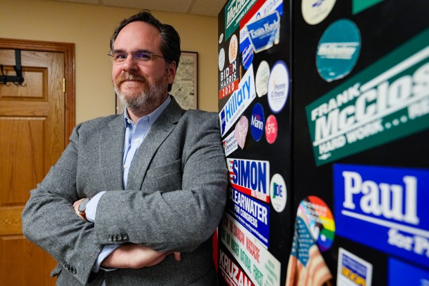 David Henry, former elections board president and current Monroe County Democratic Chairman, poses in the offices of the Monroe County Democratic headquarters in Bloomington, Ind., Tuesday, Feb. 13, 2024. Monroe County now hopes fears of a rocky primary in May will ease with the naming of a new election supervisor promoted to the position Feb. 12. Voters will select candidates for president, governor and the U.S. Senate in the primary. But the institutional knowledge remains. (AP Photo/Michael Conroy)