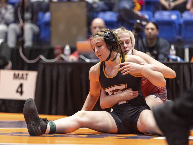 Lockport's Claudia Heeney, right, wrestles against Freeport's Cadence Diduch in the 125-pound bout of the girls wrestling state meet at Grossinger Motors Arena in Bloomington on Saturday Feb. 25, 2023.