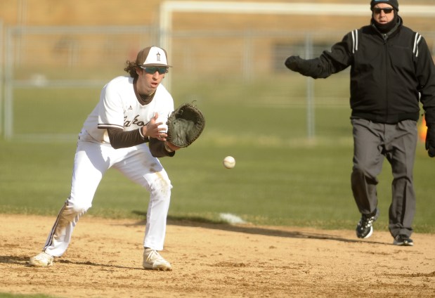 Joliet Catholic's first baseman Jake Troyner (22) fields the ball against Lockport during the WJOL / Don Ladas Memorial Baseball Tournament Wednesday, March 27, 2024 in Joliet, IL. (Steve Johnston/Daily Southtown)