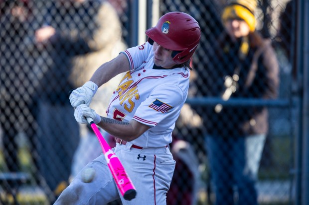 Tinley Park's Nolan Maciejewski (5) connects on a pitch against Marian Catholic during a nonconference game in Tinley Park on Wednesday, March 20, 2024. (Vincent D. Johnson/for the Daily Southtown)