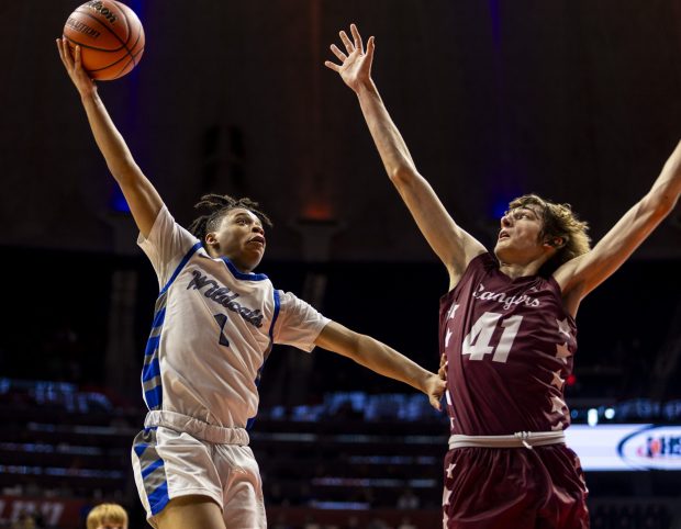 Phillips' Amari Edwards (1) on a skyhook over Benton's Docker Tedeschi (41) during the Class 2A state championship game at State Farm Center in Champaign on Saturday, March 9, 2024. (Vincent D. Johnson/for the Daily Southtown)