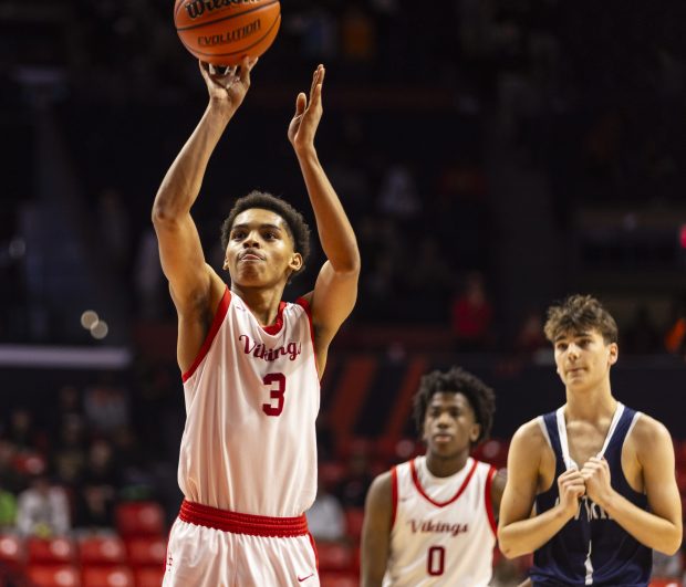 Homewood-Flossmoor's Caleb Chavers (3) shoots his second-free throw in the final seconds of the Class 4A state semifinal game against New Trier at the State Farm Center in Champaign on Friday, March 8, 2024. (Vincent D. Johnson/for the Daily Southtown)