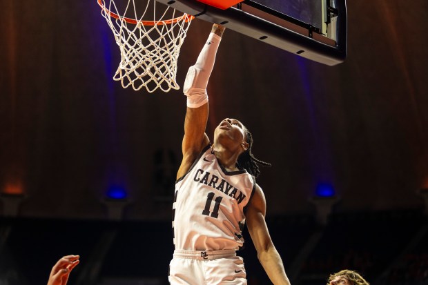 Mount Carmel's Lee Marks (11) lays the ball up against Mt. Zion during the Class 3A state semifinals at the State Farm Center in Champaign Friday, March 8, 2024. (Vincent D. Johnson/for the Daily Southtown)