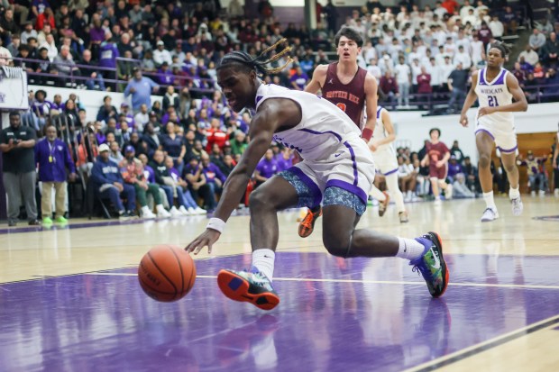 Thornton's Isaiah Green (15) grabs a loose ball during the Class 3A Thornton Sectional final against Brother Rice on Friday, March 1, 2024. (Troy Stolt/for the Aurora Beacon News)