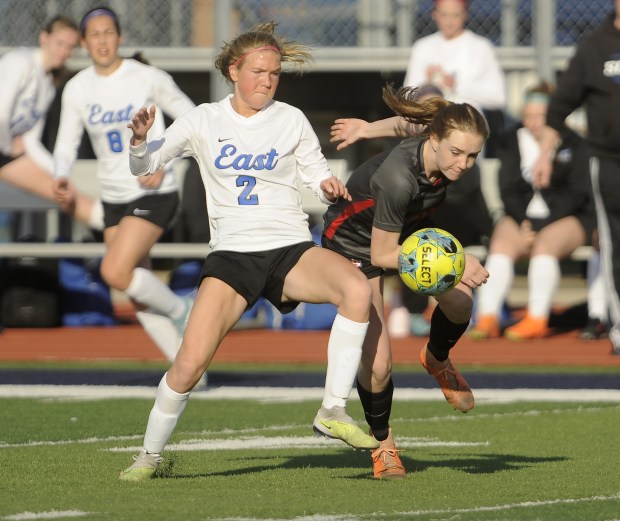 Lincoln-Way East's Kara Waishwell (2) and Lincoln-Way Central's Alyssa Sudkamp (11) battle for control of the ball during the Windy City Ram Classic semifinals Tuesday, March 19, 2024 in Burbank, IL. (Steve Johnston/Daily Southtown)