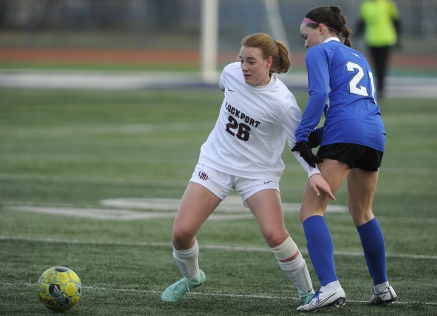 Lockport's Meghan Mack (26) defends Lincoln-Way East's Payton Lucitt (21) during the Windy City Ram Classic Championship game Thursday, March 21, 2024 in Burbank, IL. (Steve Johnston/Daily Southtown)