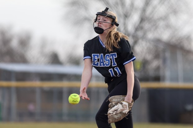 Lincoln-Way East's Audrey Bullock (11) throws a pitch during a game against St. Laurence on Tuesday, March 12, 2024. (Troy Stolt/for the Daily Southtown)