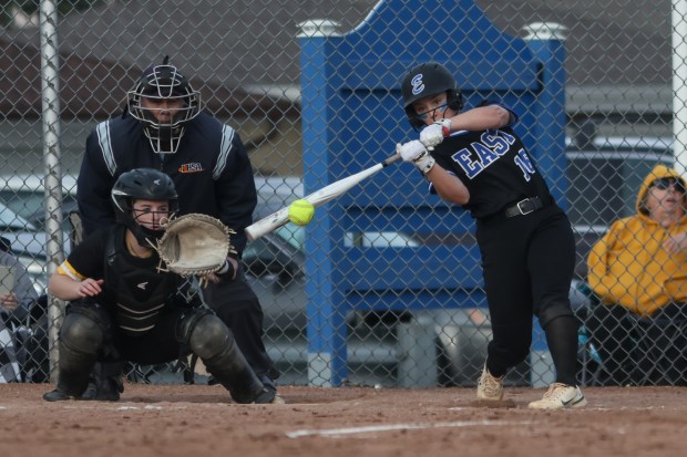 Lincoln-Way East's Kelsey Schroeder (16) gets a hit during a game against St. Laurence on Tuesday, March 12, 2024. (Troy Stolt/for the Daily Southtown)