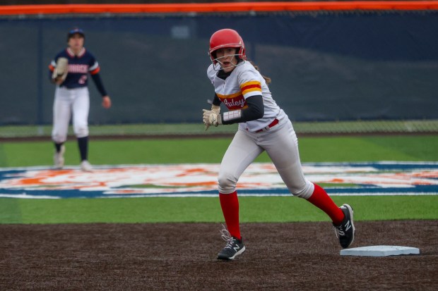 Mother McAuley's Abbey Williams (11) heads toward third base during a game against Stagg in Palos Hills on Thursday, March 14, 2024. (Troy Stolt/for the Daily Southtown)