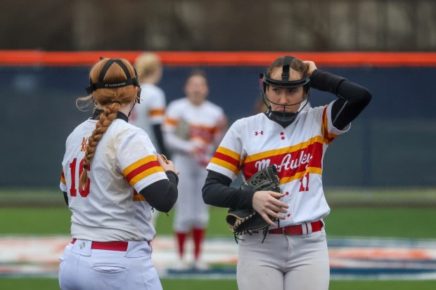 Mother McAuley's Abbey Williams (11) adjusts her head gear during a game against Stagg in Palos Hills on Thursday, March 14, 2024. (Troy Stolt/for the Daily Southtown)