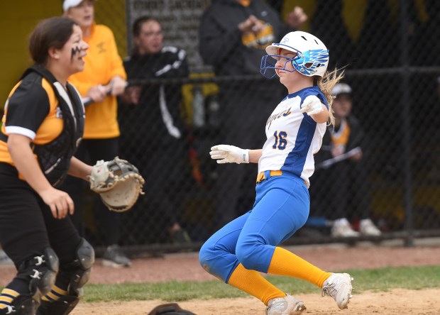 Sandburg's Ashley Fuller (16) slides into home to score the Eagles first run against Richards during a nonconference game Wednesday, March 13, 2024 in Oak Lawn, IL. (Steve Johnston/Daily Southtown)