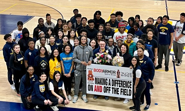 Maggie Butler, an athletic trainer at Thornwood High School in South Holland, was surprised and honored with the National Making A Difference On AND Off The Field Award. (Buddy's HELPERS)