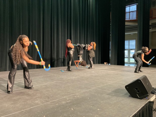 Aliana Gist, from left, Destiny Harris, Destiny "D.J." Johnson, Makyla Tate and Samantha Soria practice their step routine March 26. (Alexandra Kukulka/Daily Southtown)