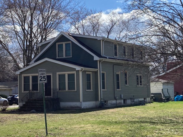 Because of their simple wooden frame construction, workers cottages such as this one on 170th Street in Hazel Crest were easy to expand and customize. In this case, roof dormers and a front foyer were added. (Paul Eisenberg/Daily Southtown)