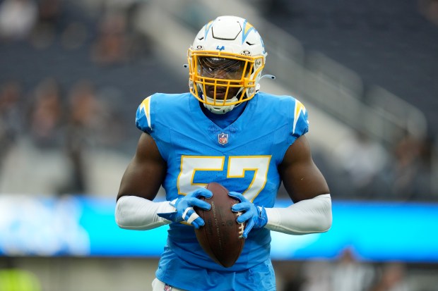 Chargers linebacker Amen Ogbongbemiga warms up before a game against the Raiders on Oct. 1, 2023, in Inglewood, Calif. (Ashley Landis/AP)
