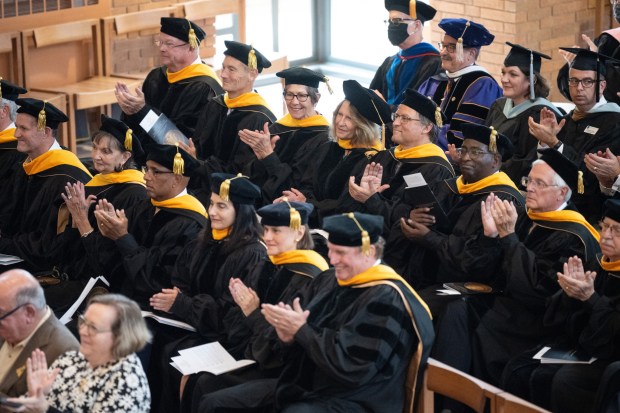 Valparaiso University officials applaud during the inauguration ceremony for new university President Jose Padilla on Saturday, October 30, 2021. (Kyle Telechan for the Post-Tribune)