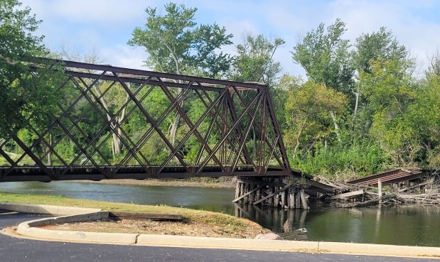 A portion of a long-abandoned railroad bridge in Carpentersville has already collapsed into the Fox River. The village is seeking bids to get rid of what's left and to remove the debris from the river.