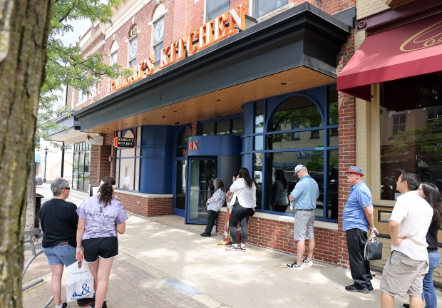 People waited in line May 30 for a chance to secure a seat at celebrity chef Gordon Ramsay's third Ramsay's Kitchen restaurant when it opened in downtown Naperville.