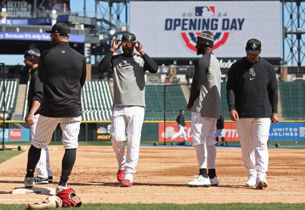 White Sox outfielder Eloy Jiménez adjusts his sunglasses during a team workout at Guaranteed Rate Field Wednesday, March 27, 2024, in Chicago. (John J. Kim/Chicago Tribune)