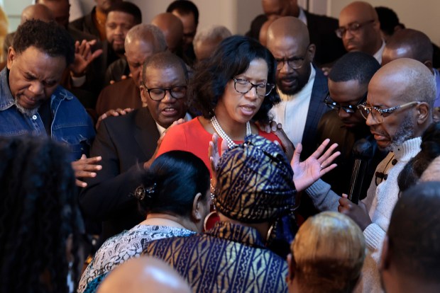 Candidate for the 7th Congressional District and City Treasurer Melissa Conyears-Ervin prays with clergy members and supporters at the Greater Missionary Baptist Church in Chicago, Feb. 28, 2024. (Antonio Perez/Chicago Tribune)