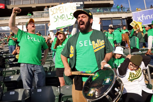 Oakland Athletics' fan Curt Silver drums while chanting "Sell the Team," at a baseball game between the A's and the Tampa Bay Rays at Oakland Coliseum in Oakland, Calif., on June 13, 2023. Thousands of frustrated, heartbroken A's fans arrived early for tailgating and solidarity at the Oakland Coliseum ahead of a Rays-A's matchup to both celebrate their team and protest a planned relocation to Las Vegas. (Scott Strazzante/San Francisco Chronicle)