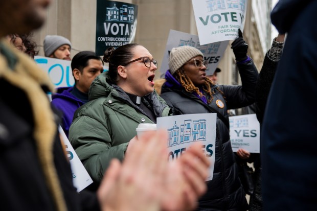 Supporters of the Bring Chicago Home referendum cheer during a press conference on Friday, March 1, 2024, outside the Appellate Court in Chicago. The press conference was called as the attorneys representing the supporters of the referendum filed an amicus brief to ensure that the referendum question is on the March 19 primary ballot. (Vincent Alban/Chicago Tribune)