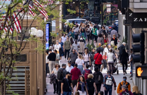 People walk on North State Street in Chicago's Loop on May 16, 2023. (Brian Cassella/Chicago Tribune)