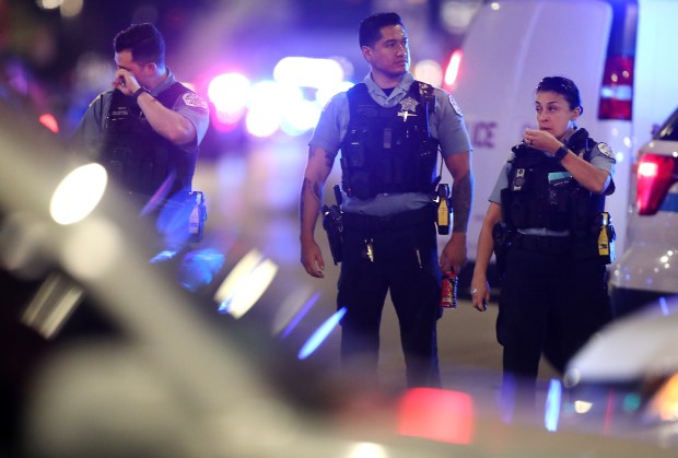 Chicago police investigate the scene where two officers were shot at 63rd Street and Bell Avenue in Chicago on Aug. 7, 2021. Officers Ella French and Carlos Yanez were shot. (Chris Sweda/Chicago Tribune)