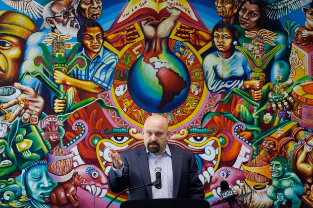 David Fish, founder of Fish Potter Bolaños, speaks with members of the press after announcing his $100,000 donation to the Instituto del Progreso Latino to fund services for migrants at the Instituto Health Science Career Academy, March 20, 2024, in Chicago. (Armando L. Sanchez/Chicago Tribune)