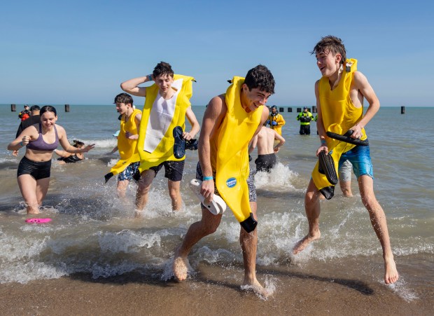 Participants dressed as bananas take a dip in Lake Michigan on a warm morning during the 24th Annual Chicago Polar Plunge, Sunday, March 3, 2024, at North Avenue Beach. (Brian Cassella/Chicago Tribune)