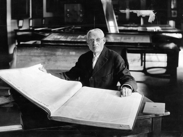 Addison Proctor reads the Chicago Tribune's account of the 1860 Republican National Convention that he attended in Chicago. Proctor was at the Chicago Historical Society, circa 1920. (Chicago Tribune historical photo) 