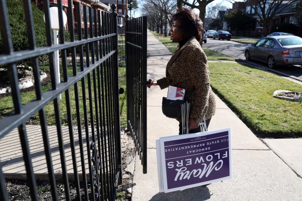 Illinois State Rep. Mary E. Flowers (D-31st) delivers lawn signs to a constituent in the 7700 block of S. Hermitage Avenue in Chicago on March 6, 2024. (Terrence Antonio James/Chicago Tribune)