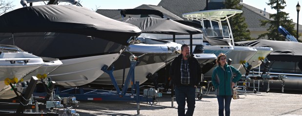 Checking out the inventory outdoors on a sunny 35 degree Thursday morning are Bruce and Danielle Saboe of Winnebago, Illinois at the Northern Illinois Boat Show on opening day, Feb. 29, 2024 at the Lake County Fairgrounds (1060 E. Peterson Road) in Grayslake. (Karie Angell Luc/Lake County News-Sun)