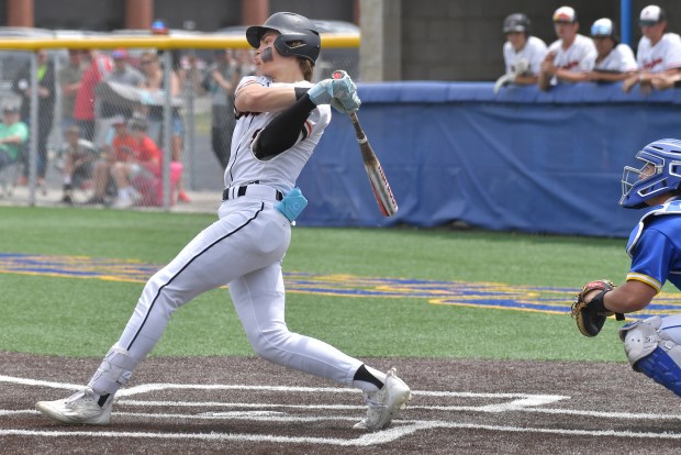 Lincoln-Way West's Conor Essenburg smashes an RBI single against the host Eagles during the Class 4A Sandburg Regional championship game against Sandburg in Orland Park on Saturday, May 27, 2023.