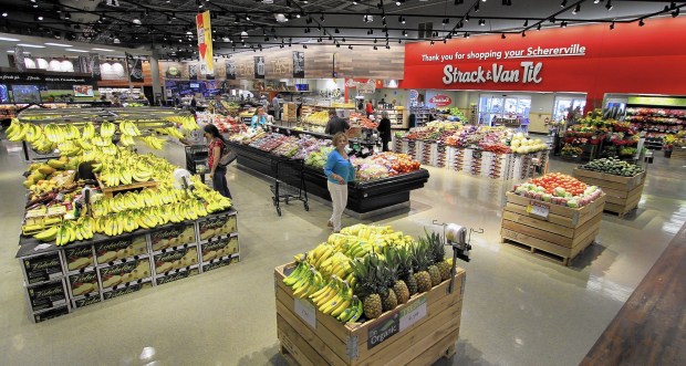 Shoppers look through the vegetables at the Strack & Van Til store in Schererville, IN., on Aug. 25, 2015.