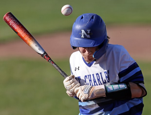 St. Charles North's Michael Buono (23) is hit by a Batavia's Gavin Rosengren pitch in the third inning during a DuKane Conference game Monday, April 15, 2024 in St. Charles.H. Rick Bamman / For the Beacon-News