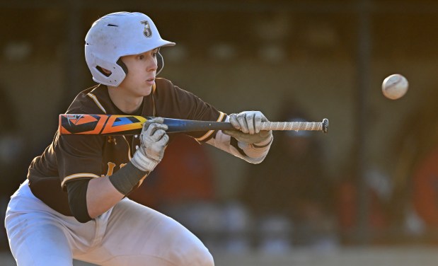 Jacobs' Mark Takasaki (7) looks to bunt during the 7th inning of Friday's game at Dundee-Crown, April 19, 2024. Jacobs won the game, 10-5. (Brian O'Mahoney for the The Courier-News)