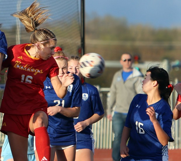Batavia's Reese Recker and Geneva's Leyna Yoneharabattle near the goal during the soccer game Tuesday, April 23, 2024, in St. Charles. (James C. Svehla/for the Beacon News)