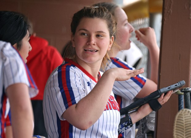 Dundee-Crown's McKayla Anderson (10) talks with teammates while reviewing stats in the dugout during a Fox Valley Conference game against Jacobs on Wednesday, April, 10, 2024 in Algonquin. Dundee-Crown won, 10-0.H. Rick Bamman / For the Beacon News