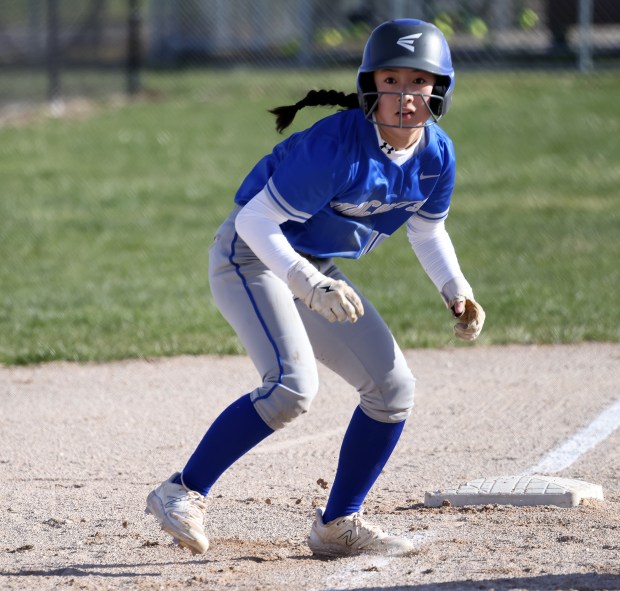 Burlington Central's Mei Shirokawa (4) takes her lead off of third base during a non-conference in game against Geneva in Burlington on Friday, April 5, 2024. Burlington Central won 14-5 in five innings.H. Rick Bamman / For the Beacon-News