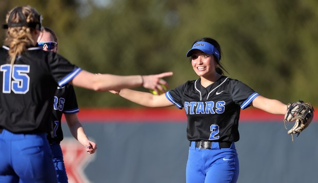 St. Charles North's Maddie Hernandez (2) reacts to Paige Murray's (15) strike out during a non-conference game against West Aurora on Monday, April, 8, 2024. St. Charles North won, 13-0.H. Rick Bamman / For the Beacon News