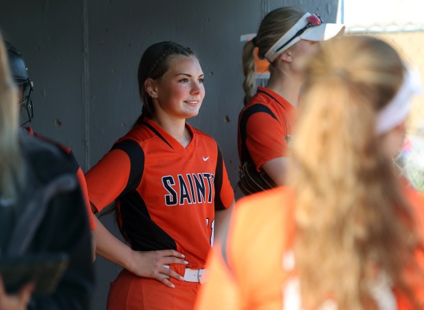 St. Charles East's catcher Sam Gaca in the dugout with teammates during the softball game against Geneva Tuesday, April 23, 2024, in Geneva. (James C. Svehla/for the Beacon News)