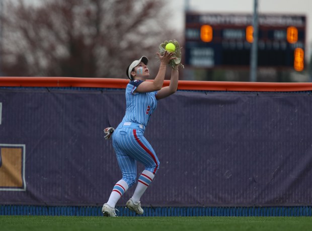 West Aurora's Mia Malczyk (2) catches an outfield fly ball during a softball game at Oswego High School in Aurora on Thursday, April 11, 2024. (Trent Sprague/for Chicago Tribune)