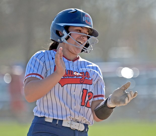 Oswego's Aubriella Garza claps as she rounds third base after hitting a two run homer. Oswego defeated Yorkville in softball, 4-1, Monday, April 15, 2024, in Oswego, Illinois. (Jon Langham/for the Beacon-News)