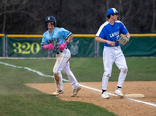 Bartlett's Josh Colaizzi (27) runs back to the dugout after being tagged out by Larkin's Peyton Wemken (18) during a game in Bartlett on Wednesday, April 10, 2024. (Nate Swanson/for The Beacon-News)