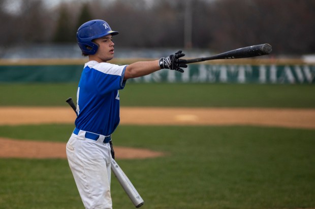 Larkin's Alan Arzola (4) returns a bat to the dugout before swinging against the Bartlett Hawks during a game in Bartlett on Wednesday, April 10, 2024. (Nate Swanson/for The Beacon-News)