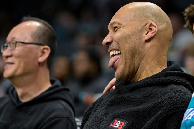 LaVar Ball smiles during the second half of an NBA basketball game between the Charlotte Hornets and Indiana Pacers, Sunday, Feb. 4, 2024, in Charlotte, N.C. (AP Photo/Matt Kelley)